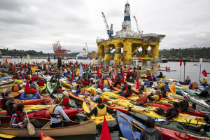 Activists who oppose Royal Dutch Shell's plans to drill for oil in the Arctic Ocean prepare their kayaks for the "Paddle in Seattle" protest on Saturday, May 16, 2015, in Seattle. The protesters gathered at a West Seattle park and then joined hundreds of others in Elliott Bay, next to the Port of Seattle Terminal 5, where Shell's Polar Pioneer drilling rig is docked. (Daniella Beccaria/seattlepi.com via AP) MAGS OUT; NO SALES; SEATTLE TIMES OUT; TV OUT; MANDATORY CREDIT